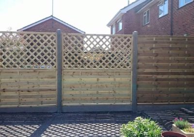 Matching timber fencing panels installed along property boundary